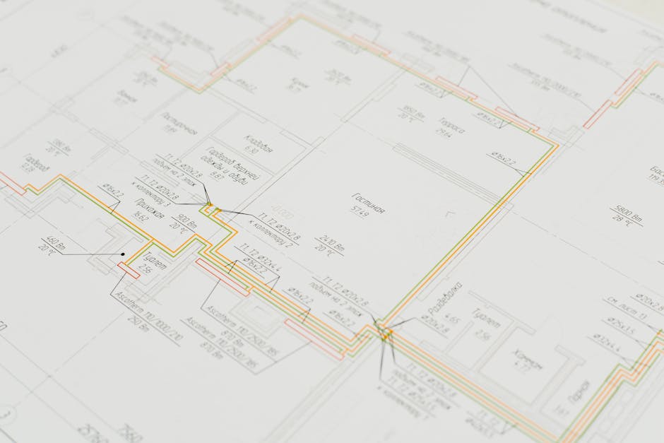 Close-up of a detailed architectural blueprint showing design plans on a desk. Ideal for construction and design concepts.